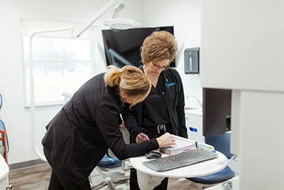 dentist performing oral surgery on a patient