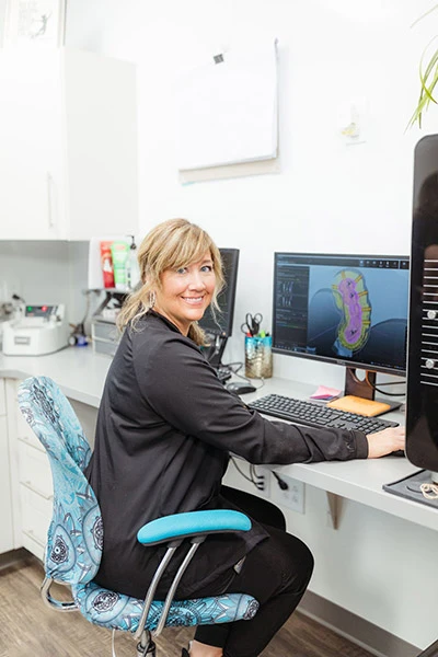 staff member viewing an orthodontic scan